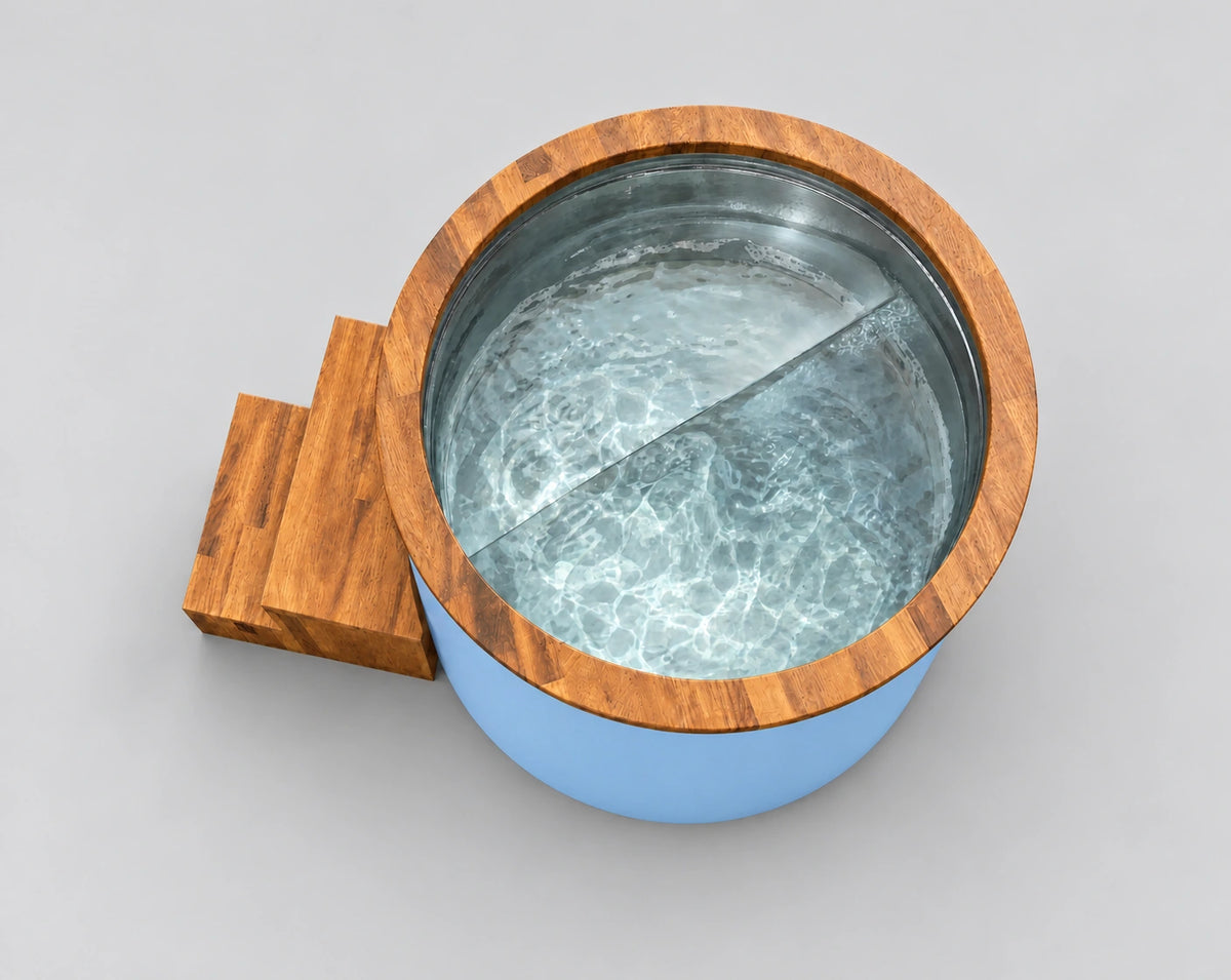 Temperd Barrel Pro cold plunge in Arctic Baby Blue, seen from above with the lid off, filled with water