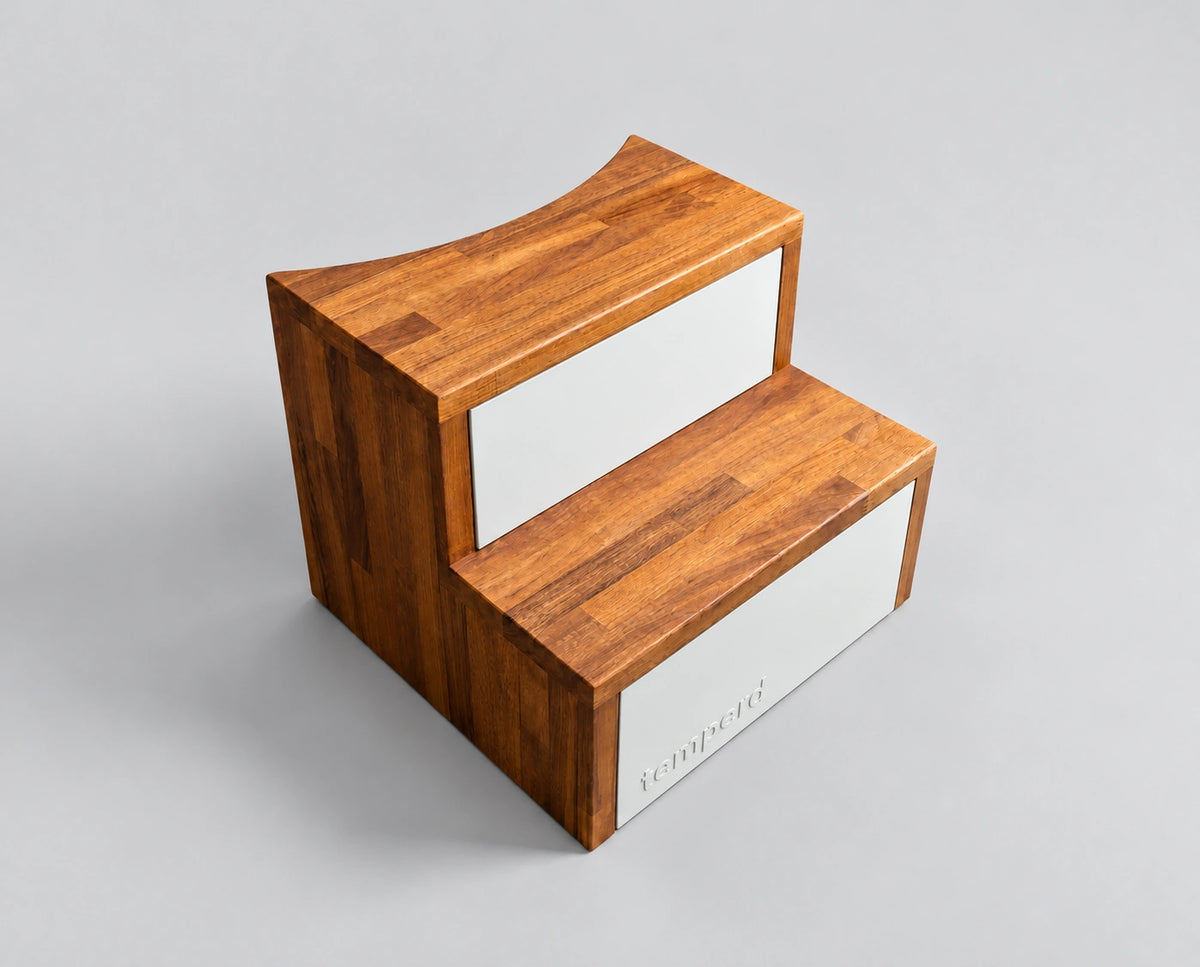 Temperd Barrel Pro cold plunge in Traffic White, close-up of the wooden entry steps with the embossed temperd logo