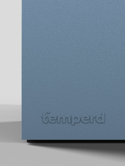 Temperd Commercial Cold Plunge in Teak with Arctic Baby Blue base, close-up of the embossed Temperd logo