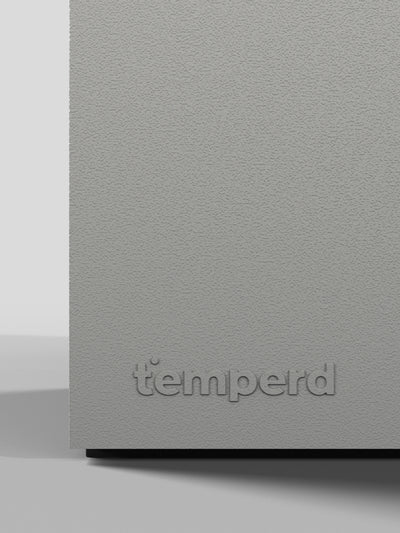 Temperd Commercial Cold Plunge in Teak with Serenity White base, close-up of the embossed Temperd logo