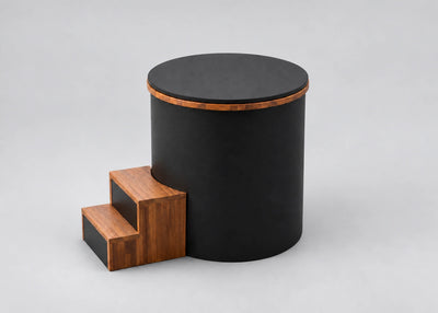 Temperd Barrel Pro cold plunge in Obsidian Black, with the lid closed and the wooden entry steps