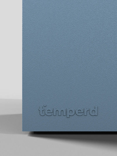 Temperd cold plunge in Teak with Arctic Baby Blue base, close-up of the embossed Temperd logo